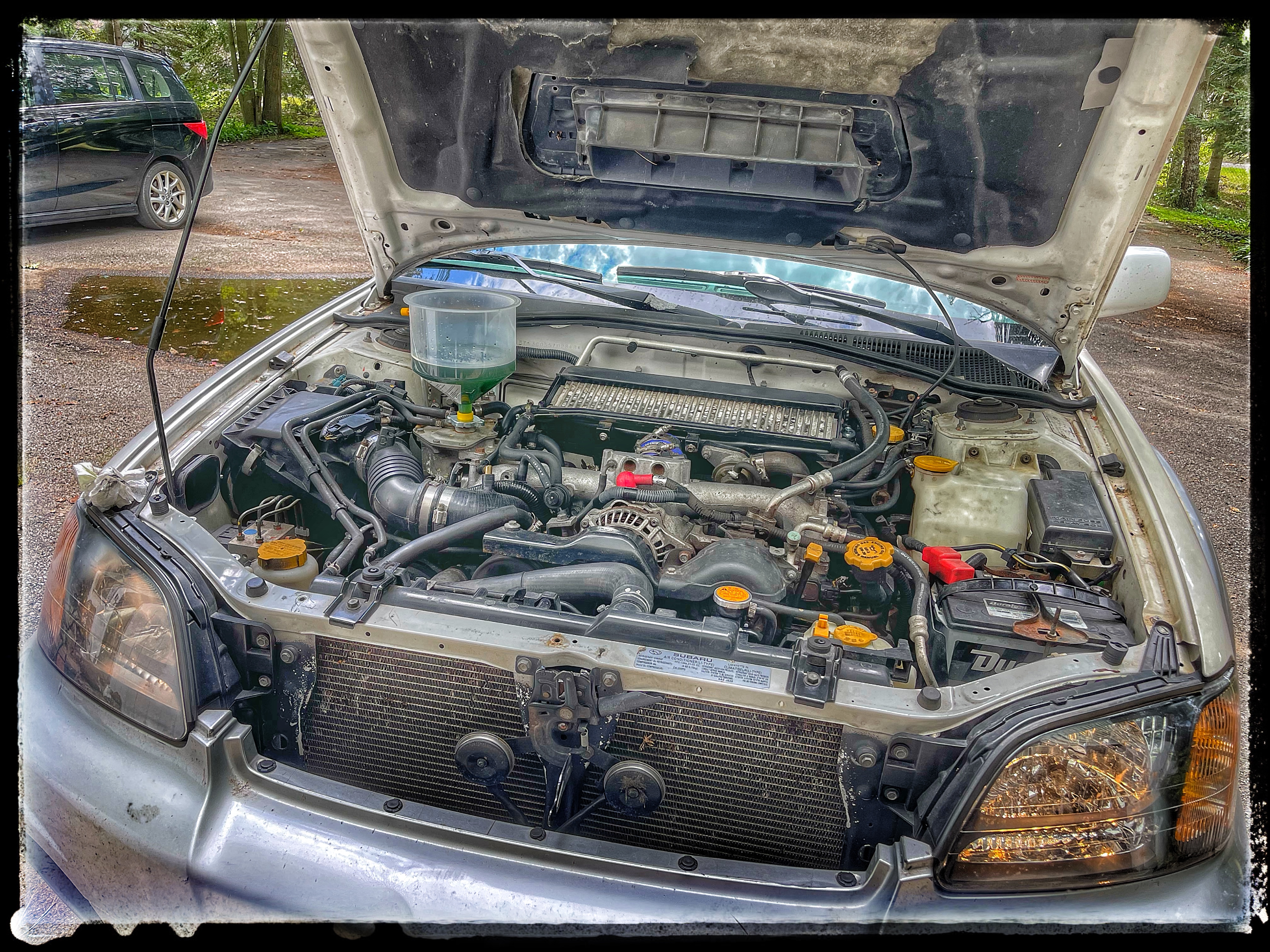 2005 Baja - Filling Coolant with Glug Jug.JPG